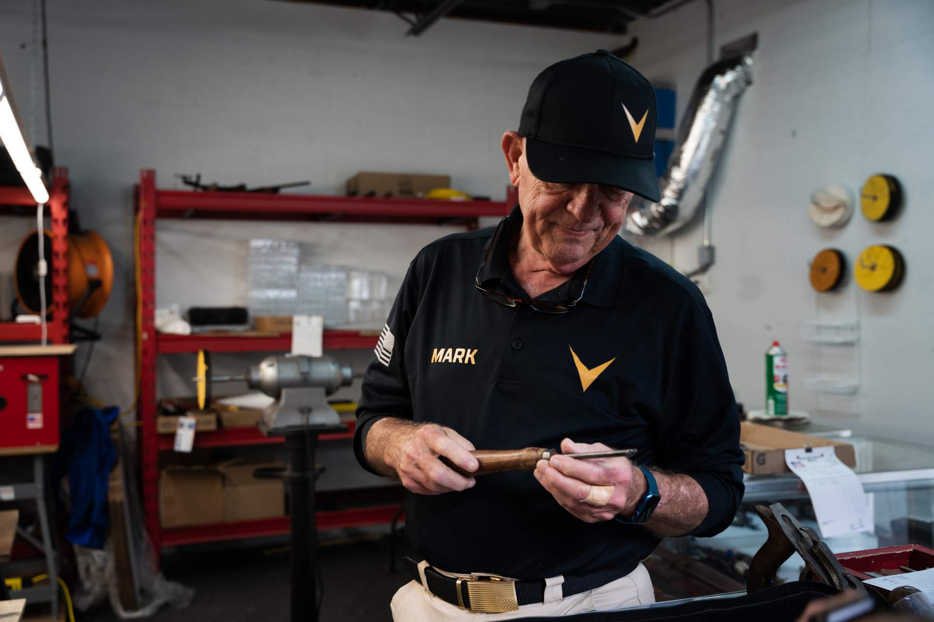 Gentleman holding a knife, observing sharpness of the blade